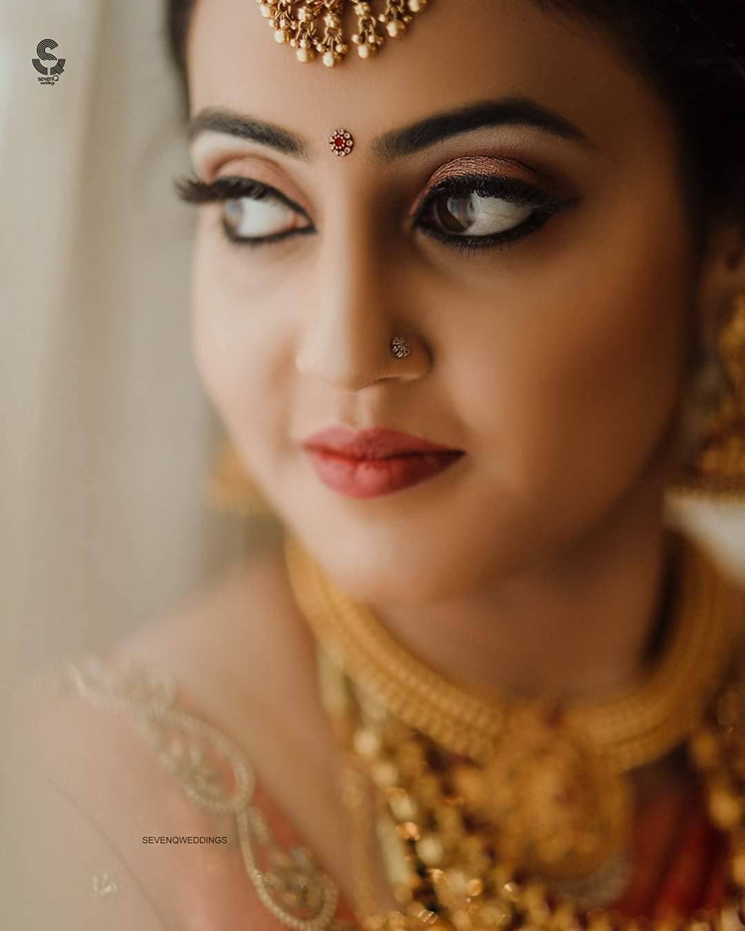 South Indian bridal makeup with kohl eyes and red lips 