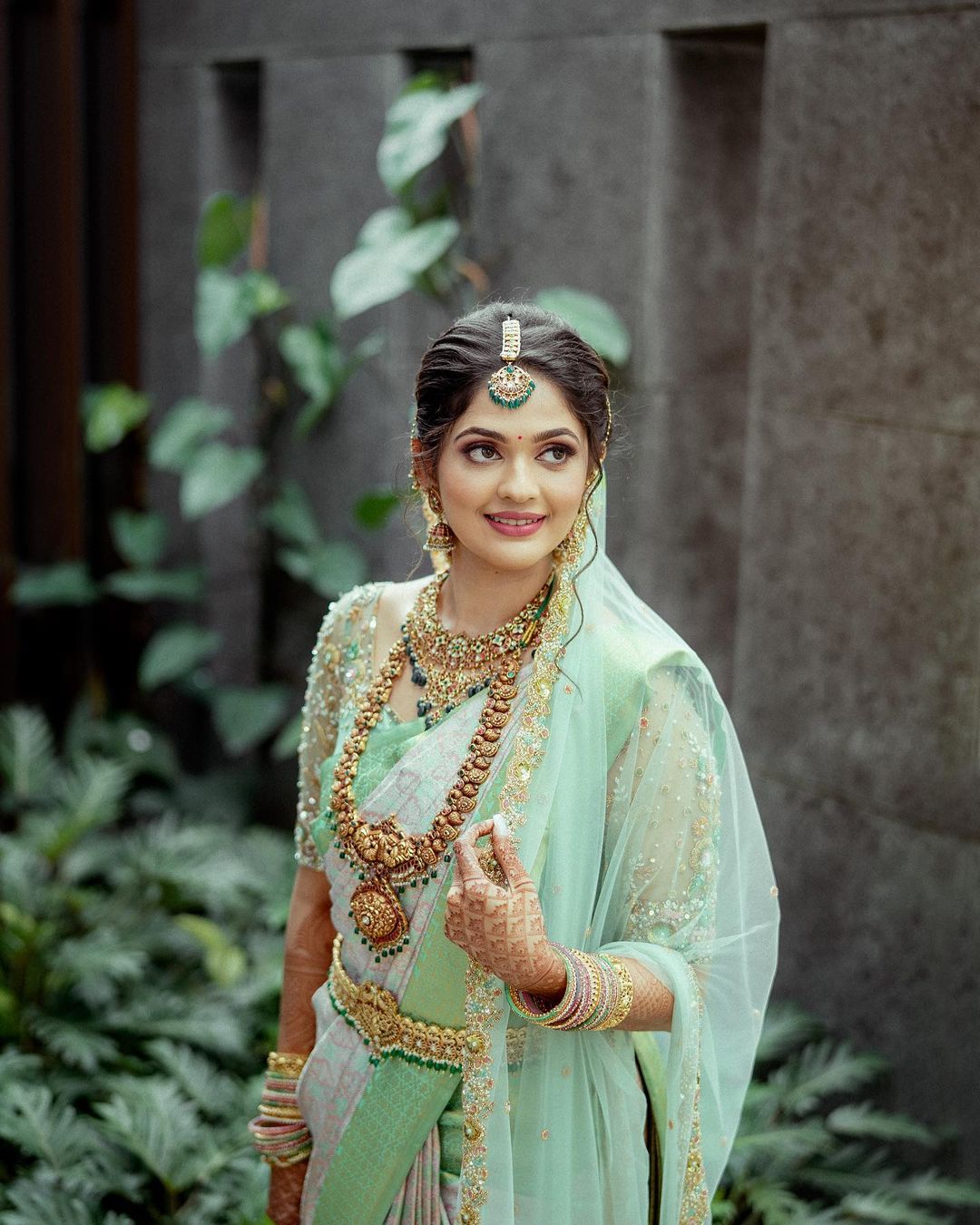 south indian bridal look in pastel green silk saree with dupatta