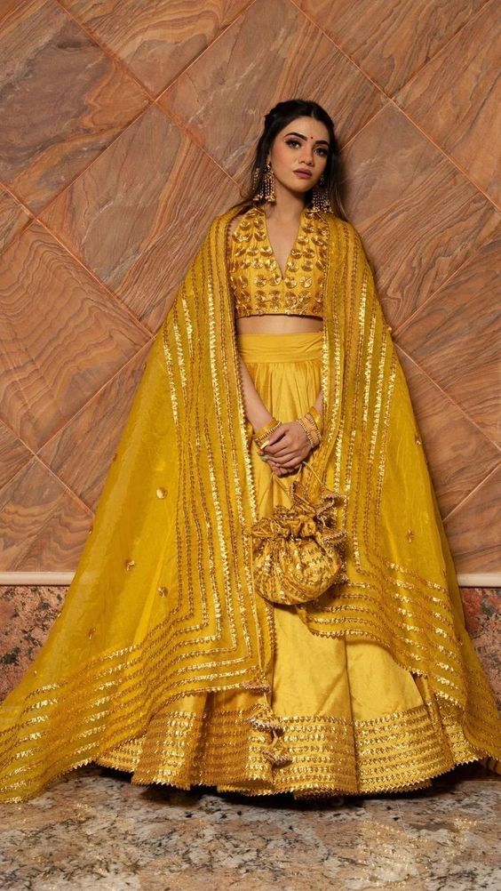 simple and traditional yellow silk lehenga choli for bride