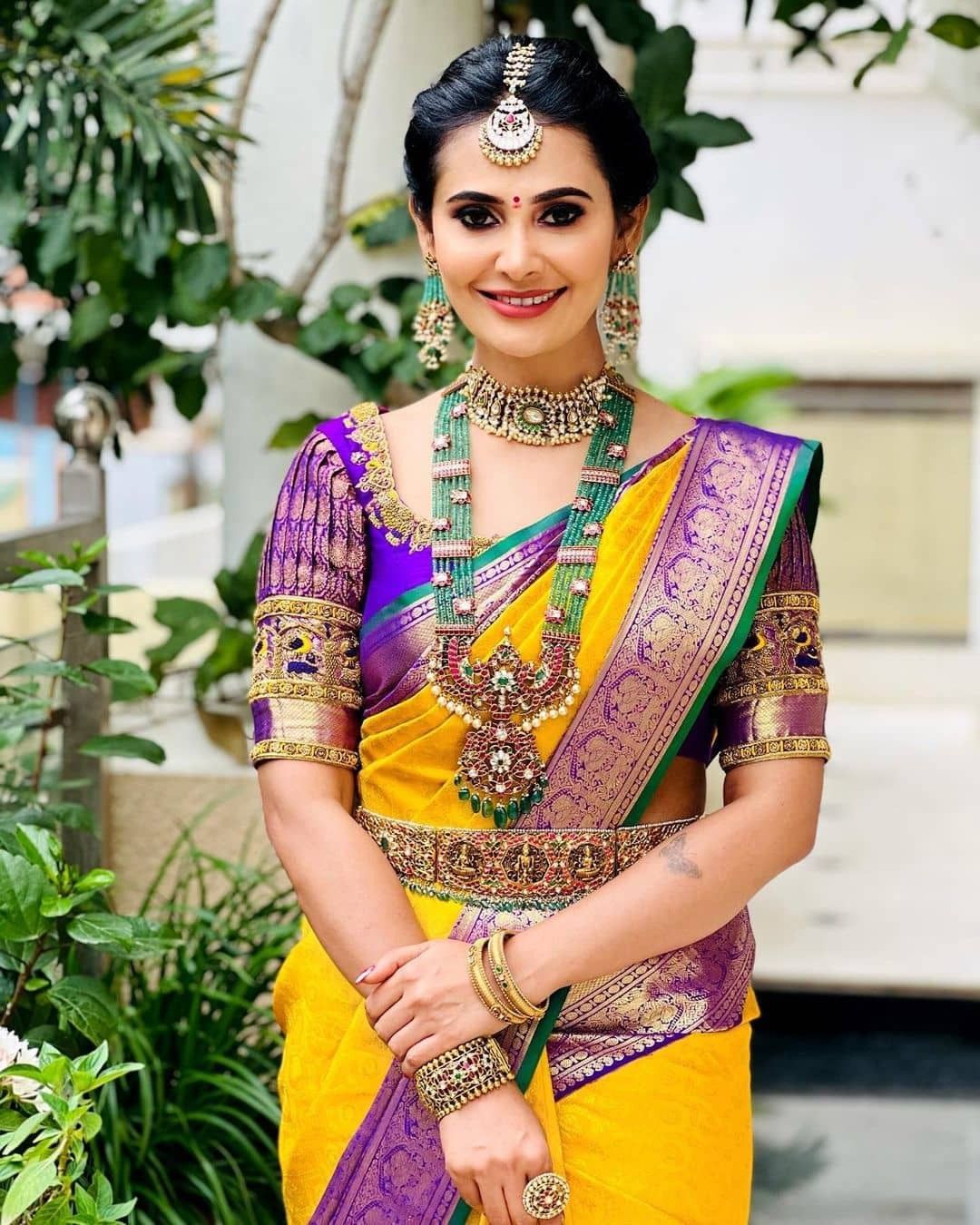 simple south bride in yellow silk sari with contrast blouse