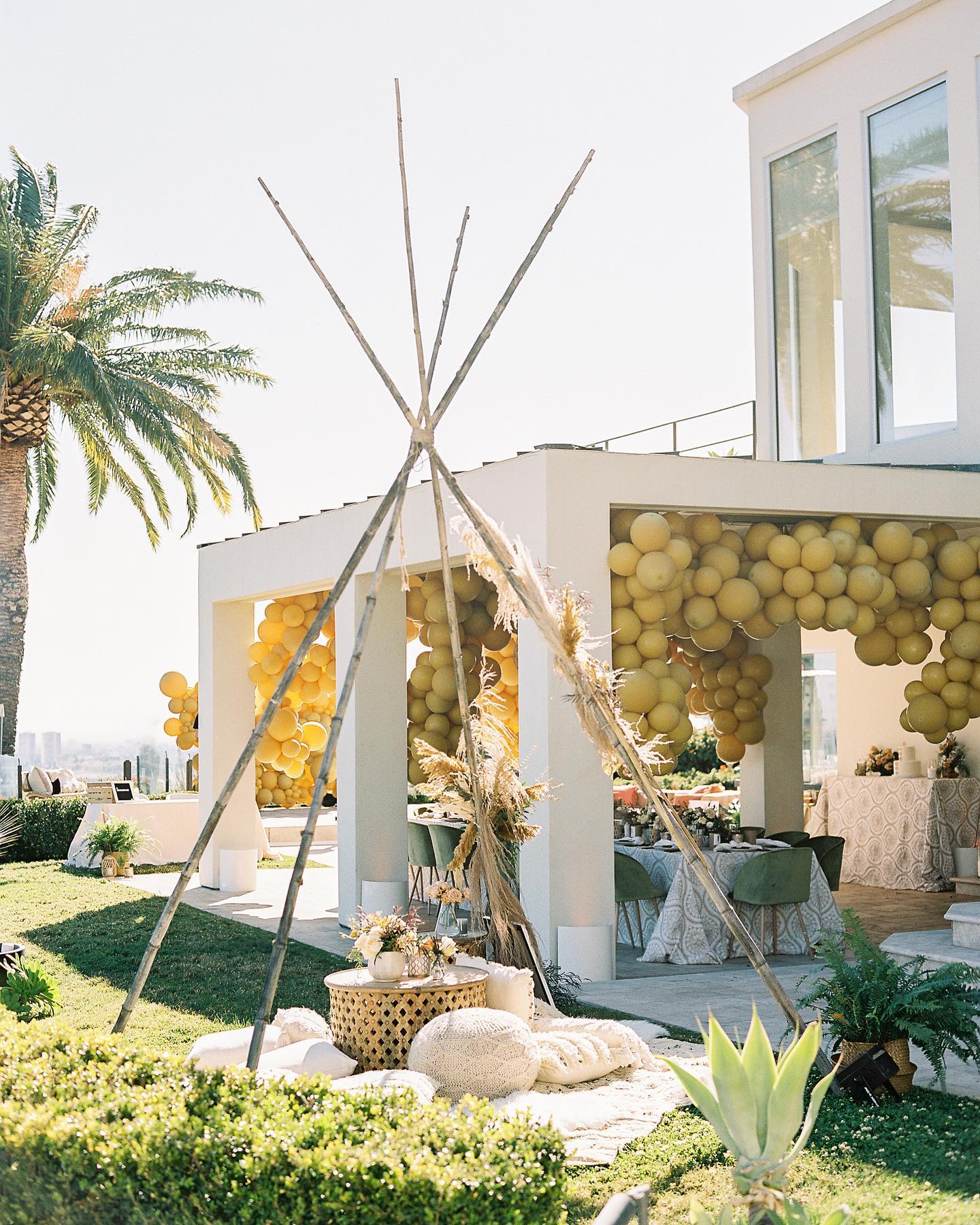 outdoor haldi decoration with yellow balloons 