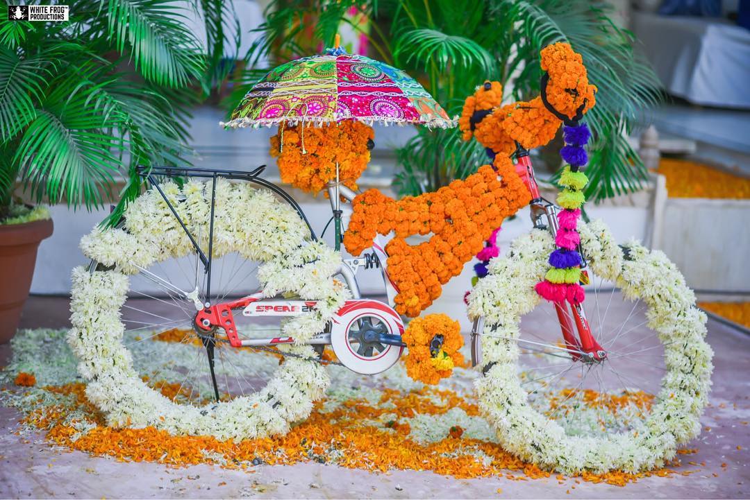 fun and colourful flower bicycle photobooth for kids for haldi