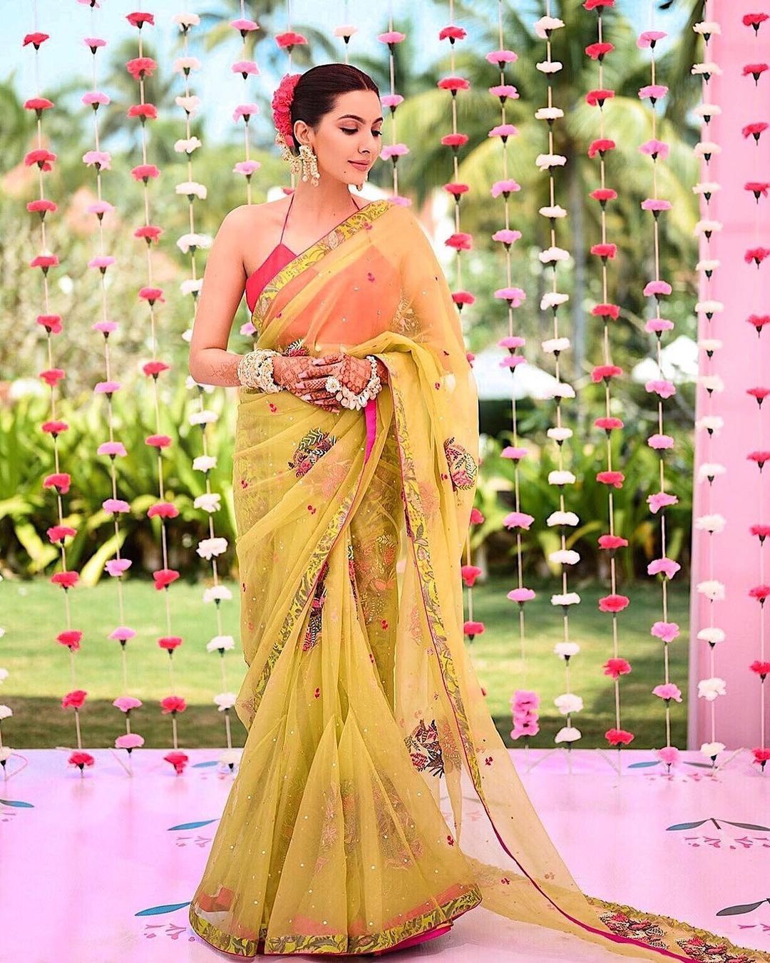 haldi bride wearing green and pink saree