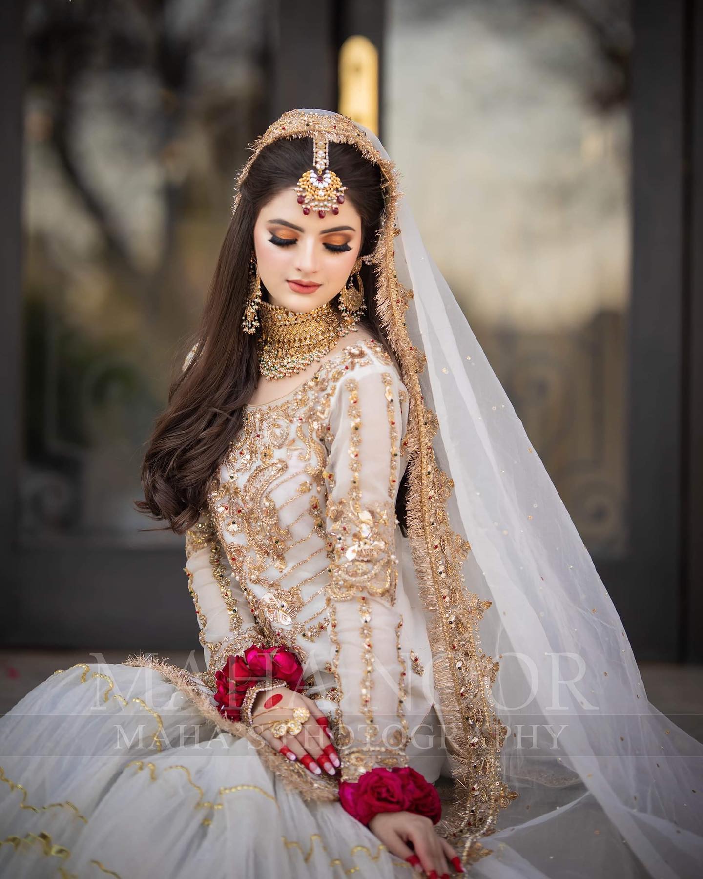 bridal photoshoot poses with bride looking down