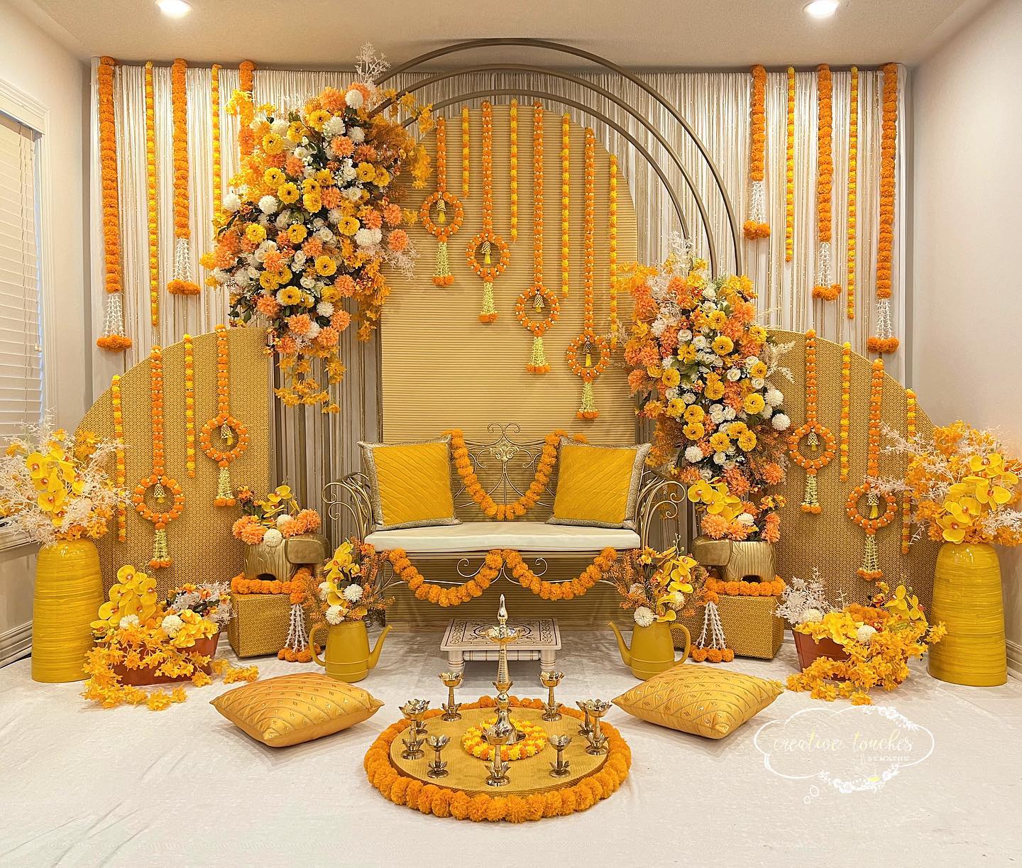 beautiful orange and yellow background haldi ceremony decoration at home