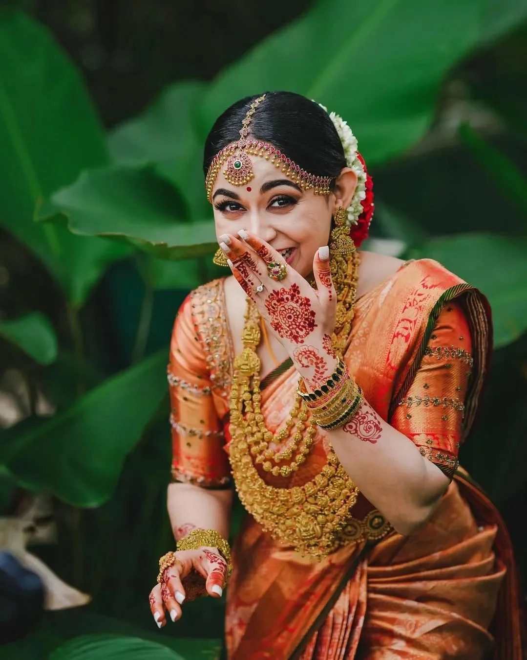 Premium Photo  A bride in a red sari poses for a photo