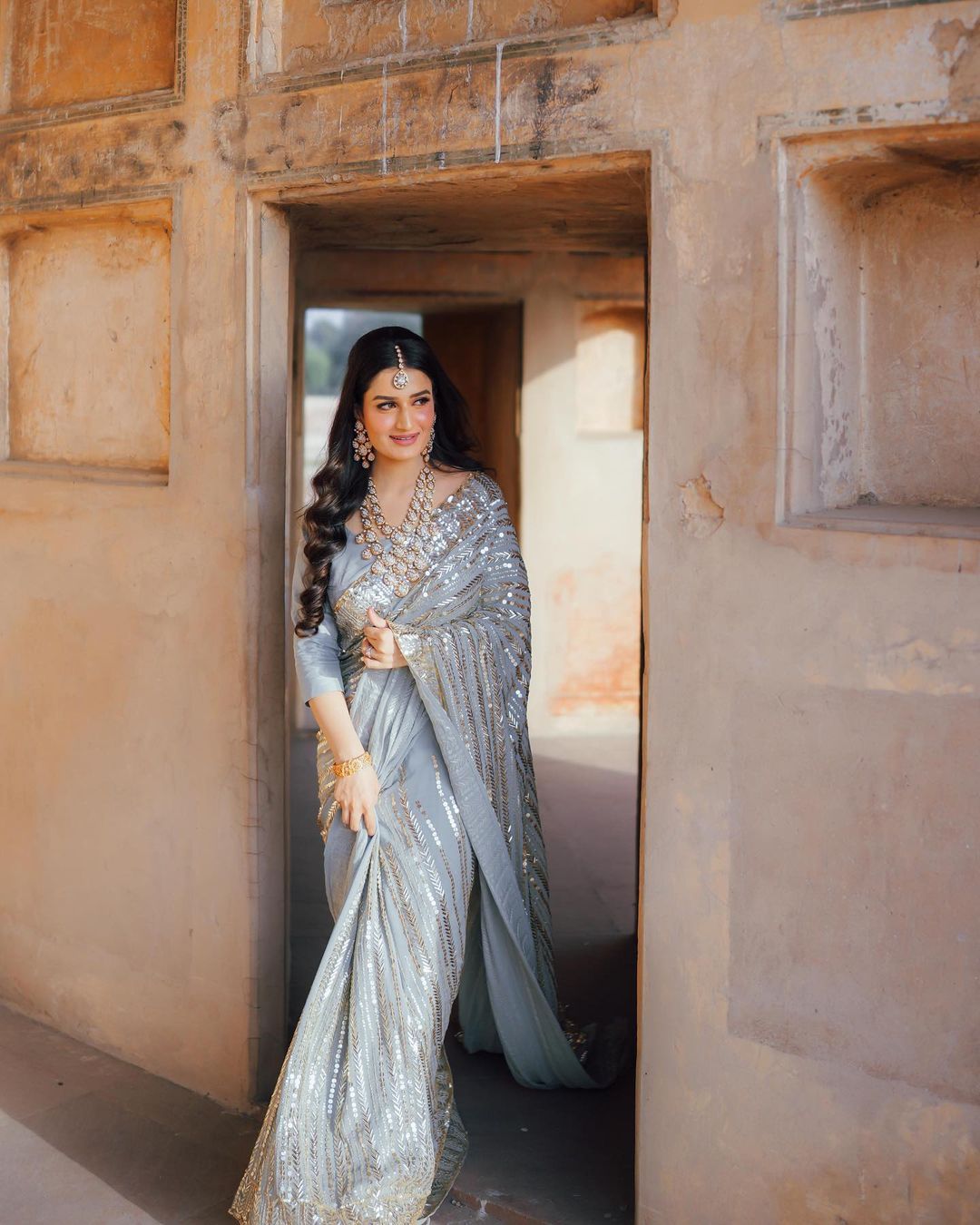 bride in grey sequin engagement saree