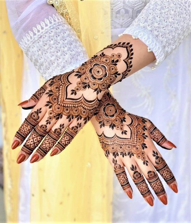 back hand flower design mehendi for bride and bridesmaid