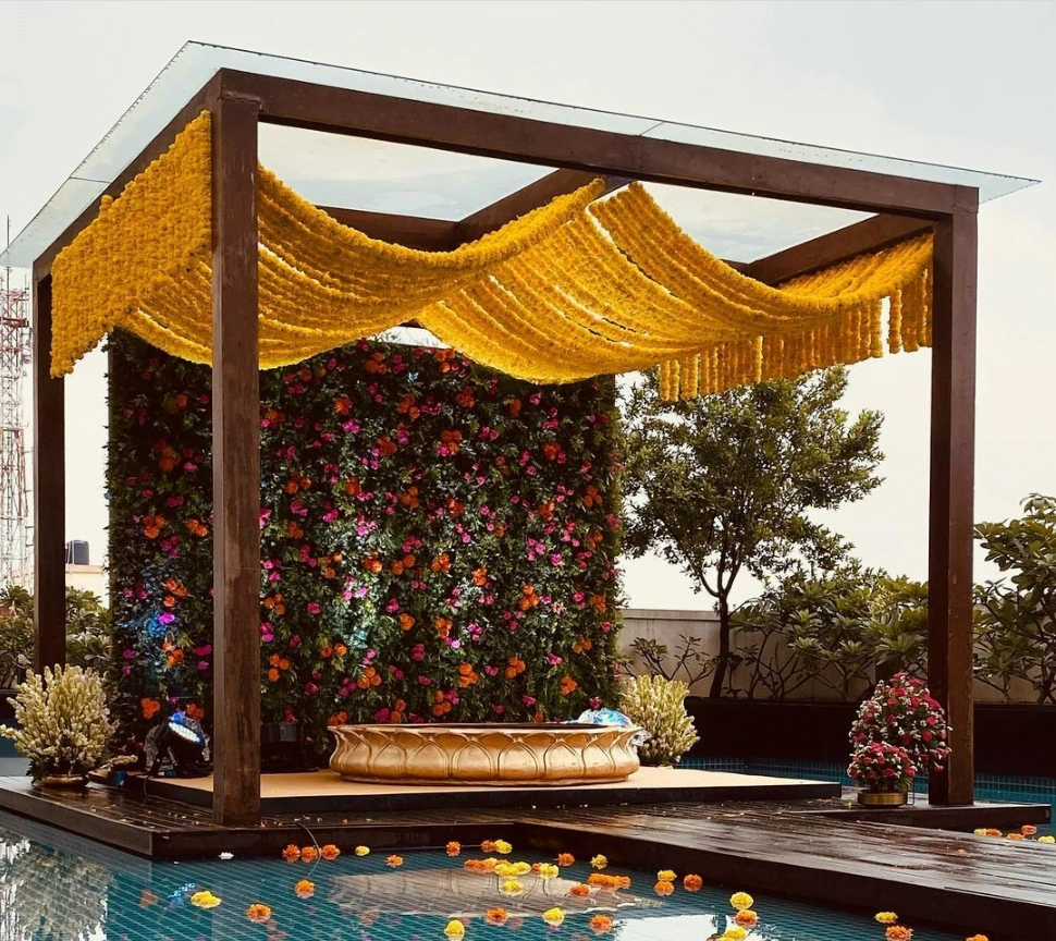 stage decoration for haldi near pool for bride and groom