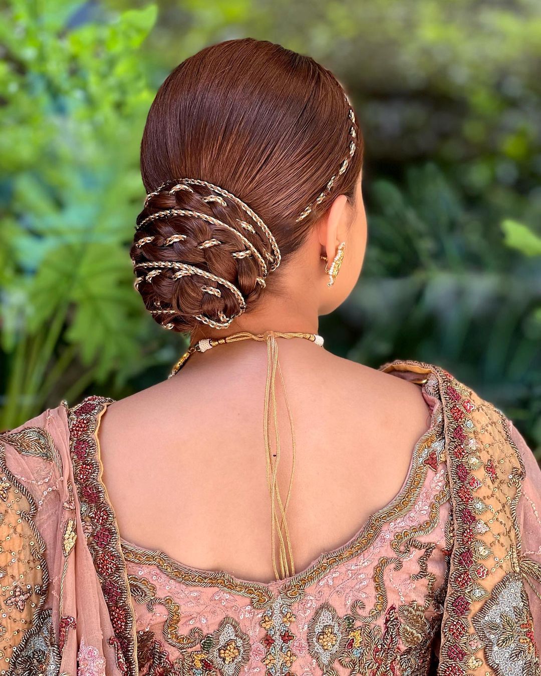 designer bun reception hairstyle for lehenga for bride