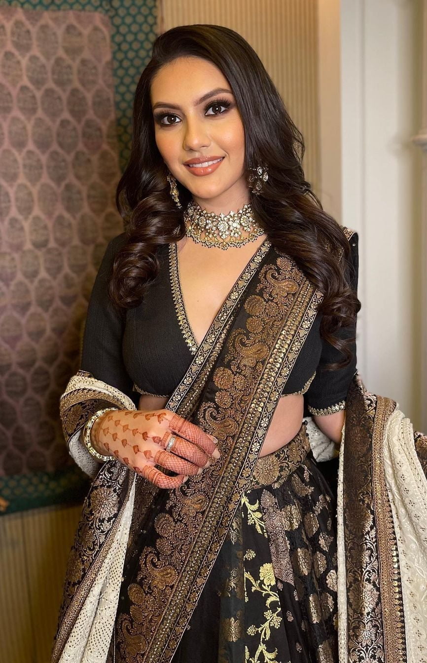 bride in black silk lehenga dress on engagement