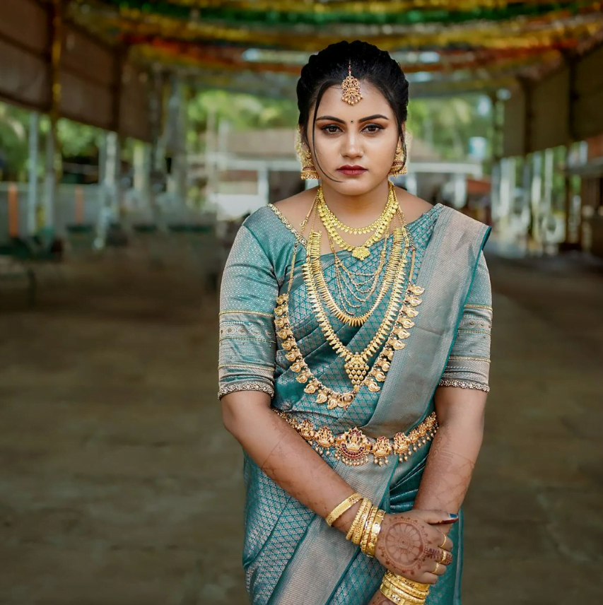 south indian bride in blue kanjeevaram saree