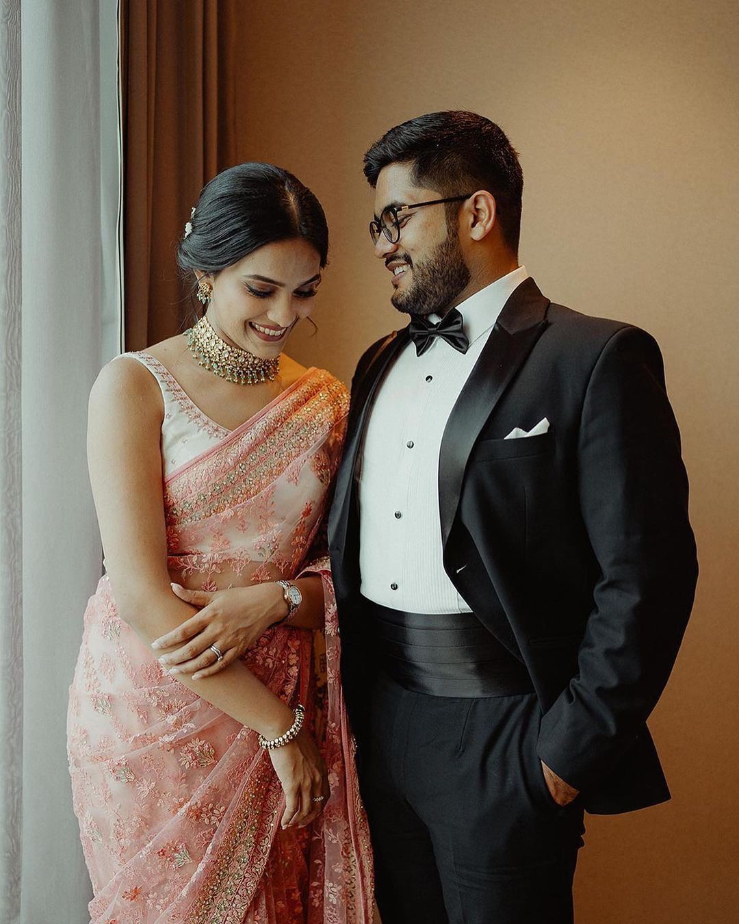 Kerala engagement couple in pink and black outfits