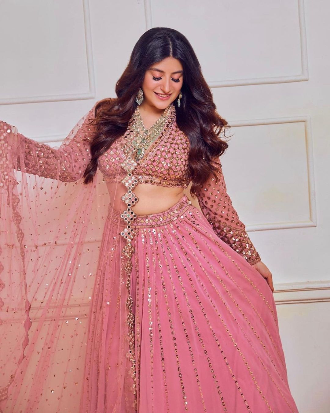 bride in monochromatic blush pink engagement lehenga