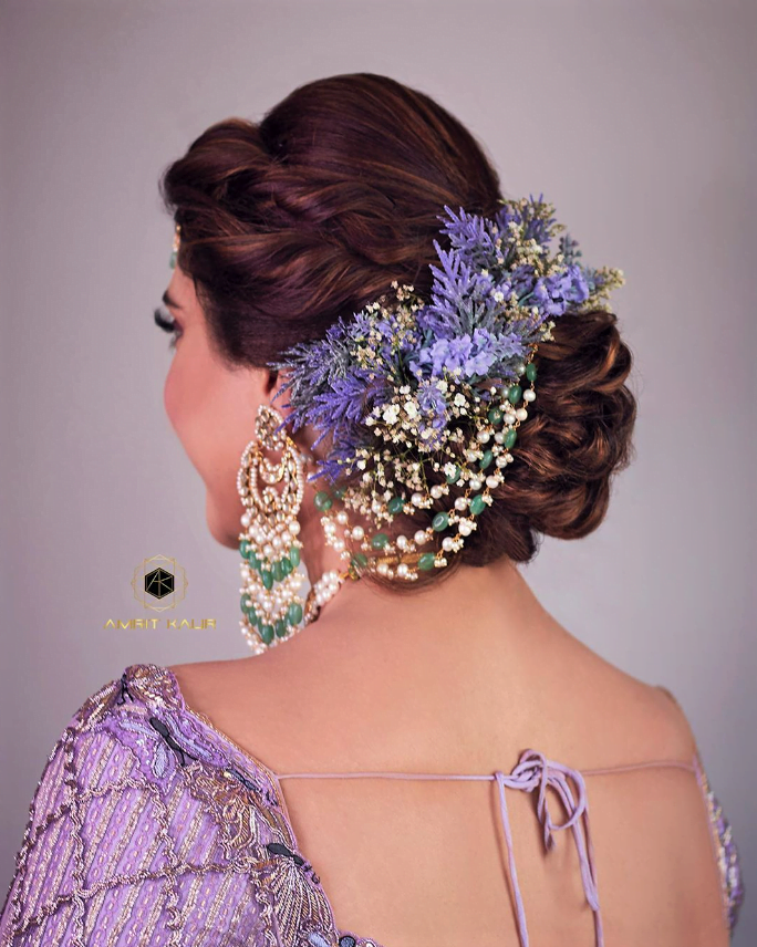 braided bun with puff and flowers for south indian reception