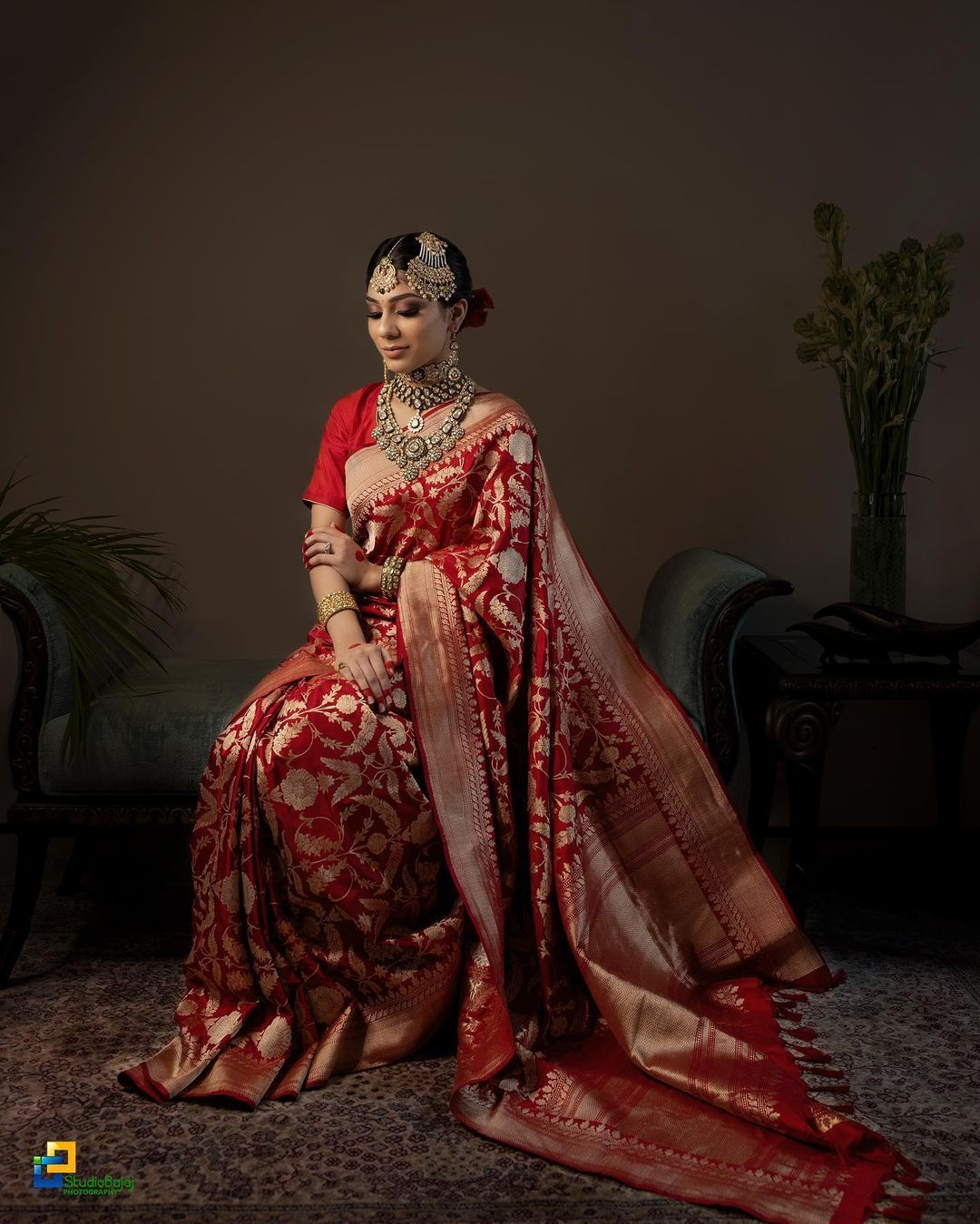 red silk saree with golden motifs and zari for wedding