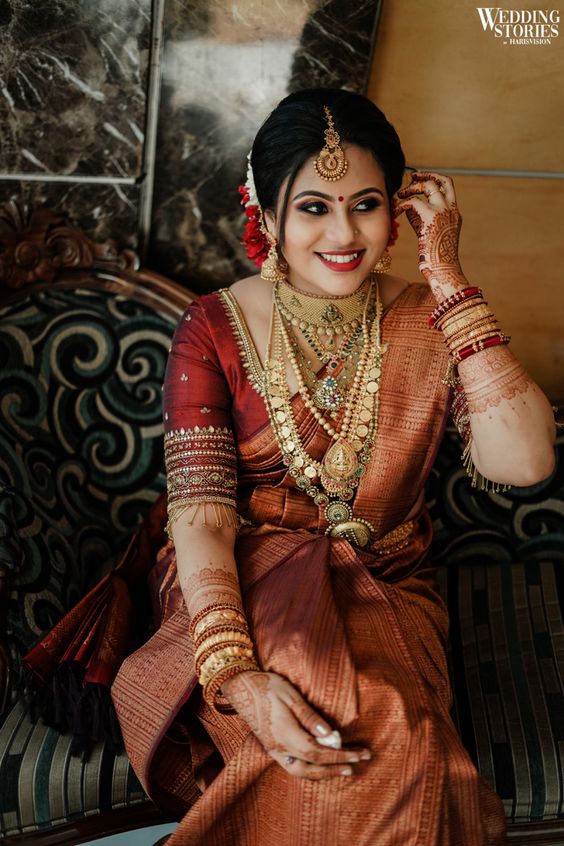 south indian bride wearing copper silk saree