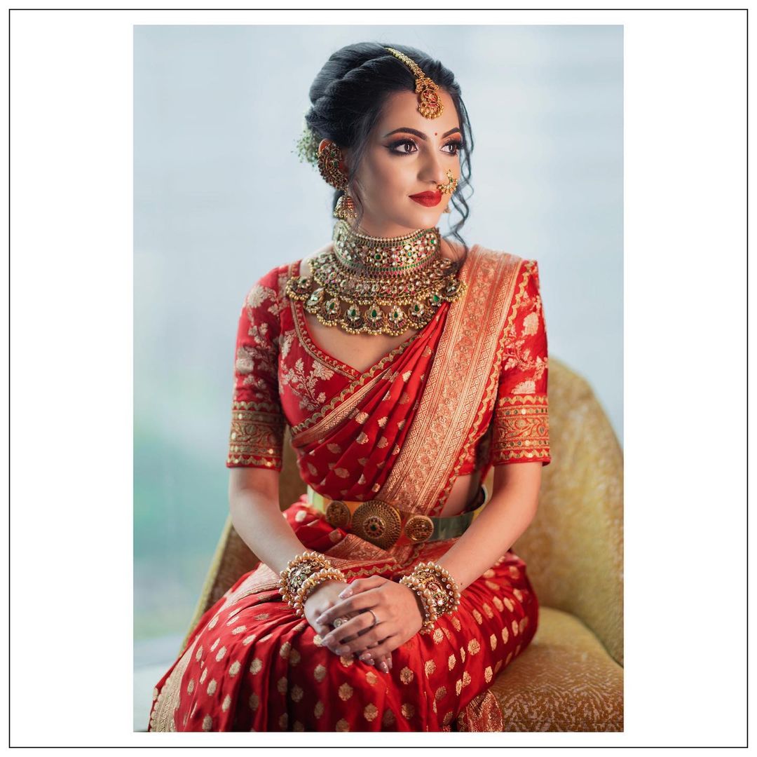 south indian bride in sabyasachi red and golden sari