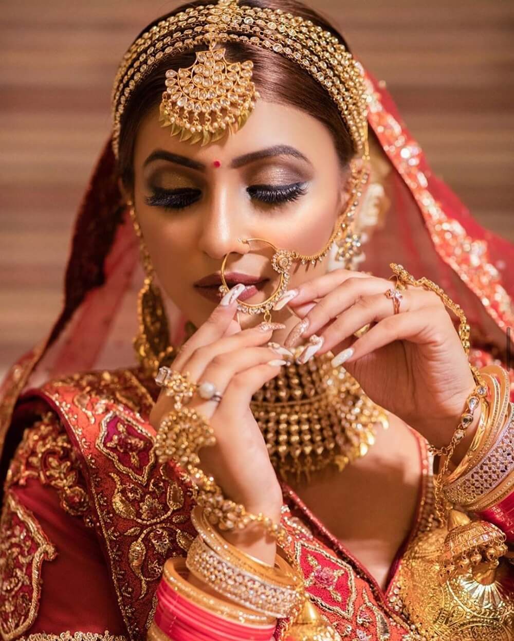 elaborate gold and kundan matha patti for wedding