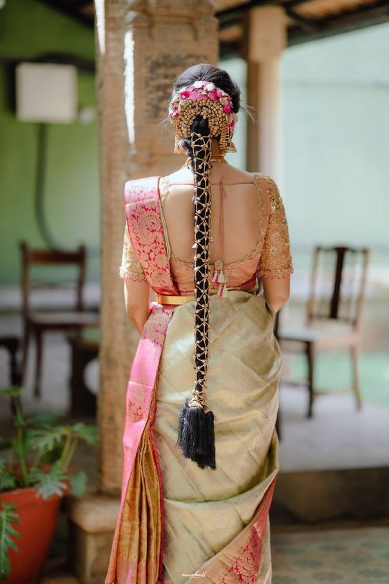 floral bun with netted gajra braid hairstyle