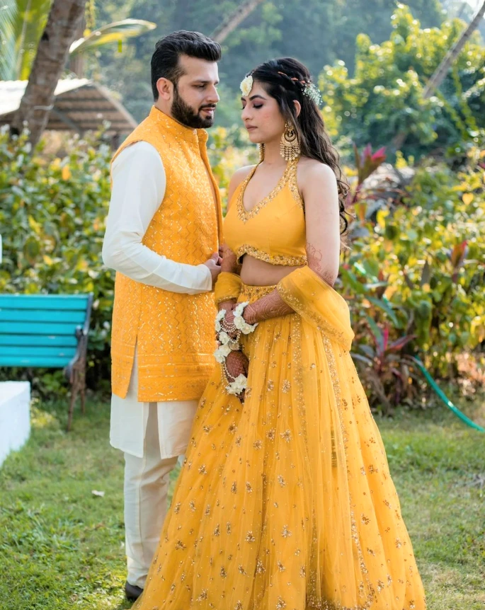 white and yellow haldi outfits for bride and groom