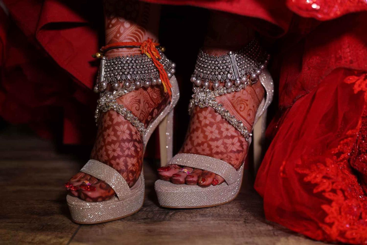 bridal wearing heavy oxidized payal in silver