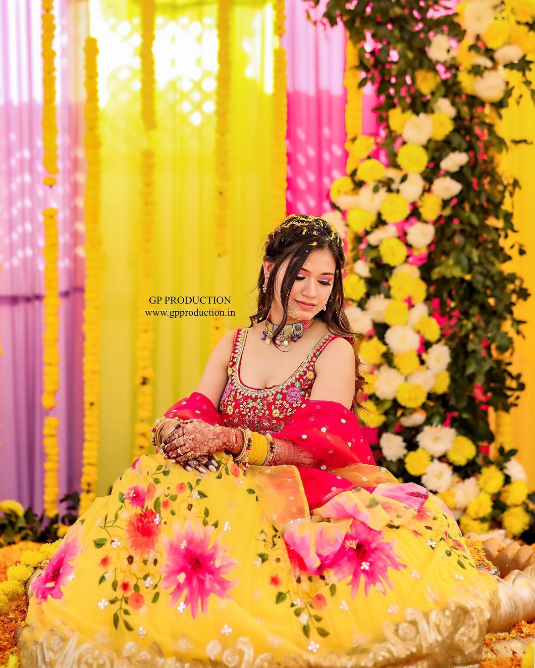 haldi look for bride in yellow and red floral lehenga