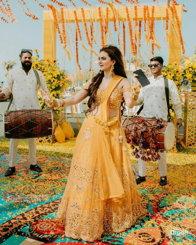 haldi bride wearing yellow off-shoulder blouse and matching skirt