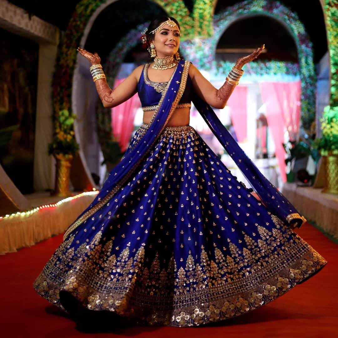 royal blue and golden embellished lehenga for mehndi for bride