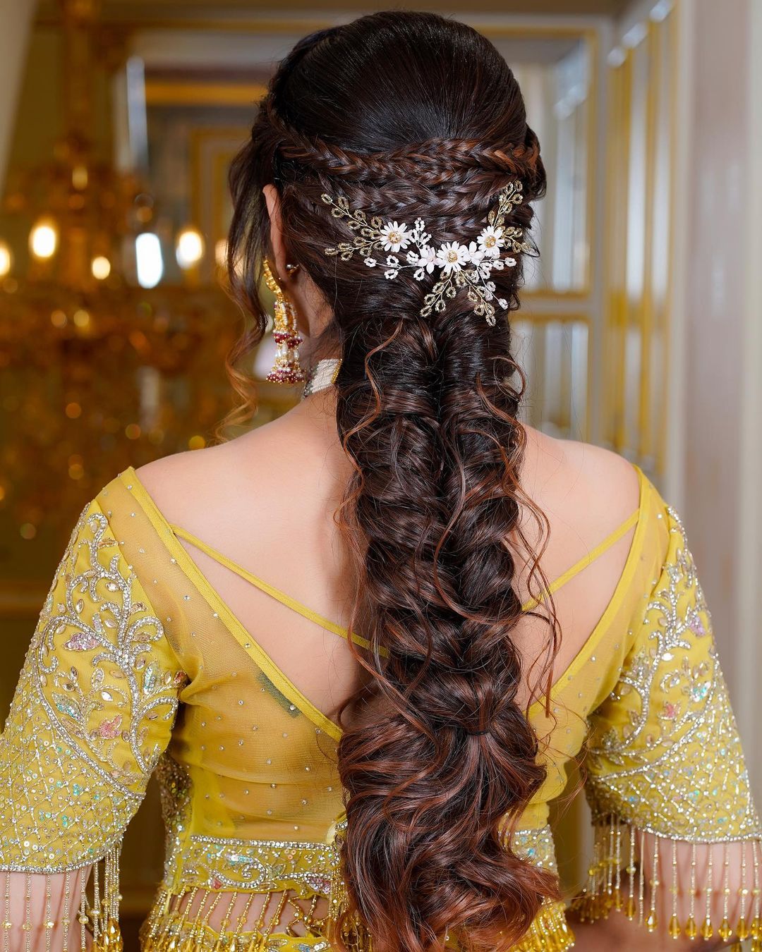 fishtail braid hairstyle with lehenga