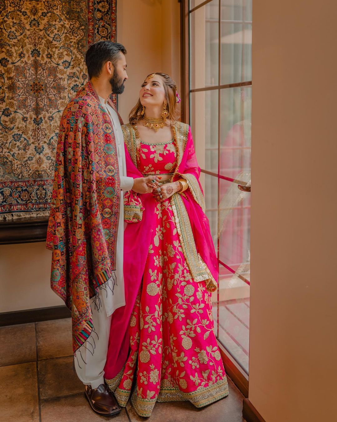 bright pink and golden colour lehenga choli for mehndi