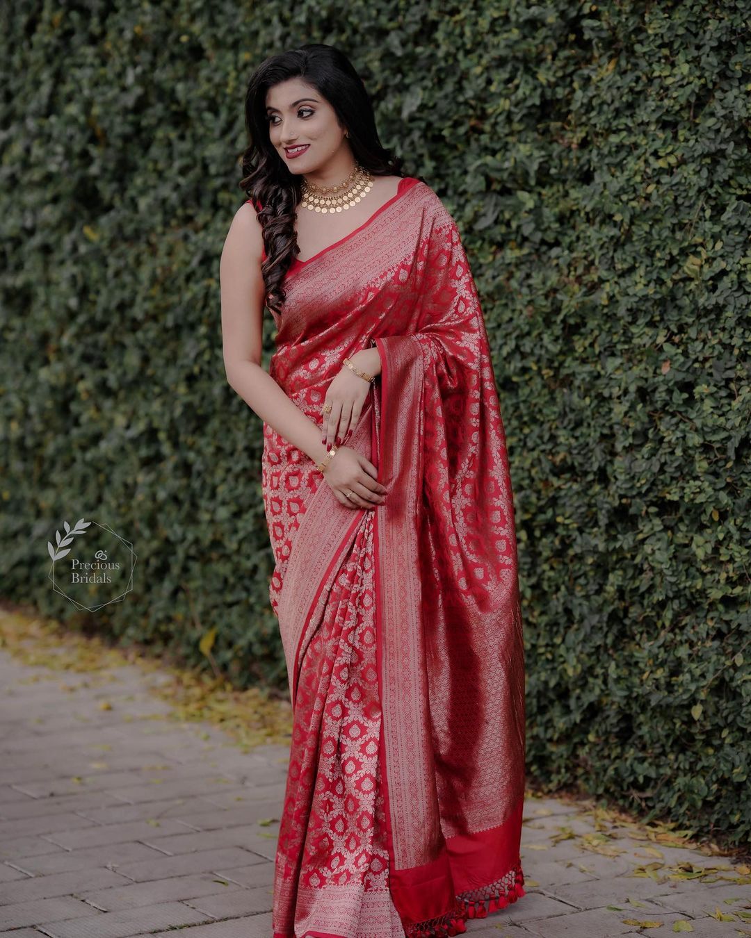 red kerala wedding saree with tassel pallu