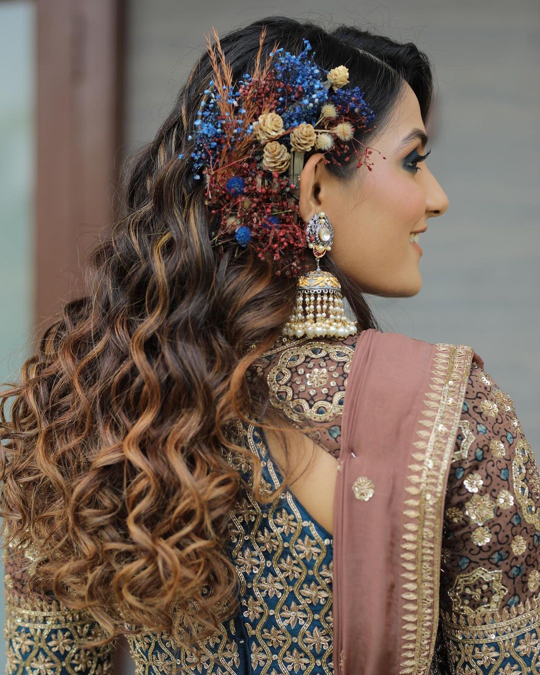 open curl hairstyle with lehenga for reception