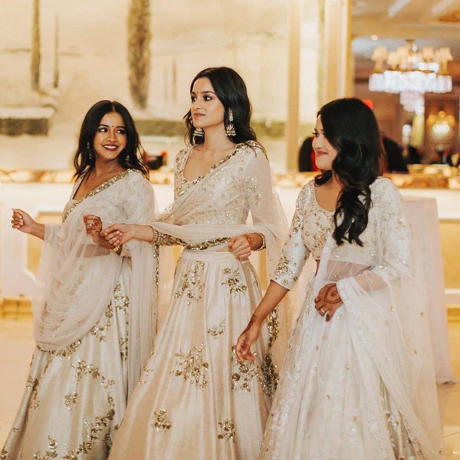 white coordinating lehenga bridesmaid dresses