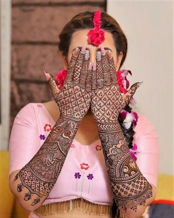 bride showing her beautiful intricate mehndi