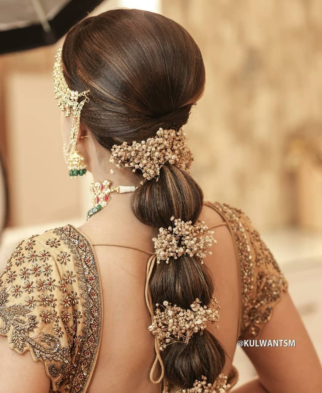 bridal hair featuring bubble braid with lehenga