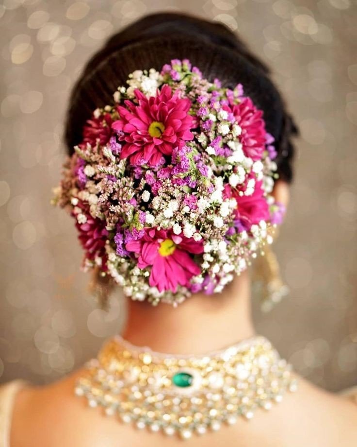 floral bun hairdo for south bride for reception