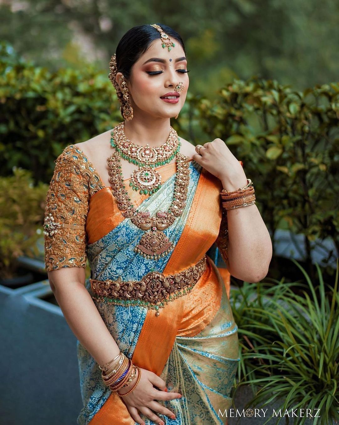 south indian bride in orange and blue Kanjeevaram saree