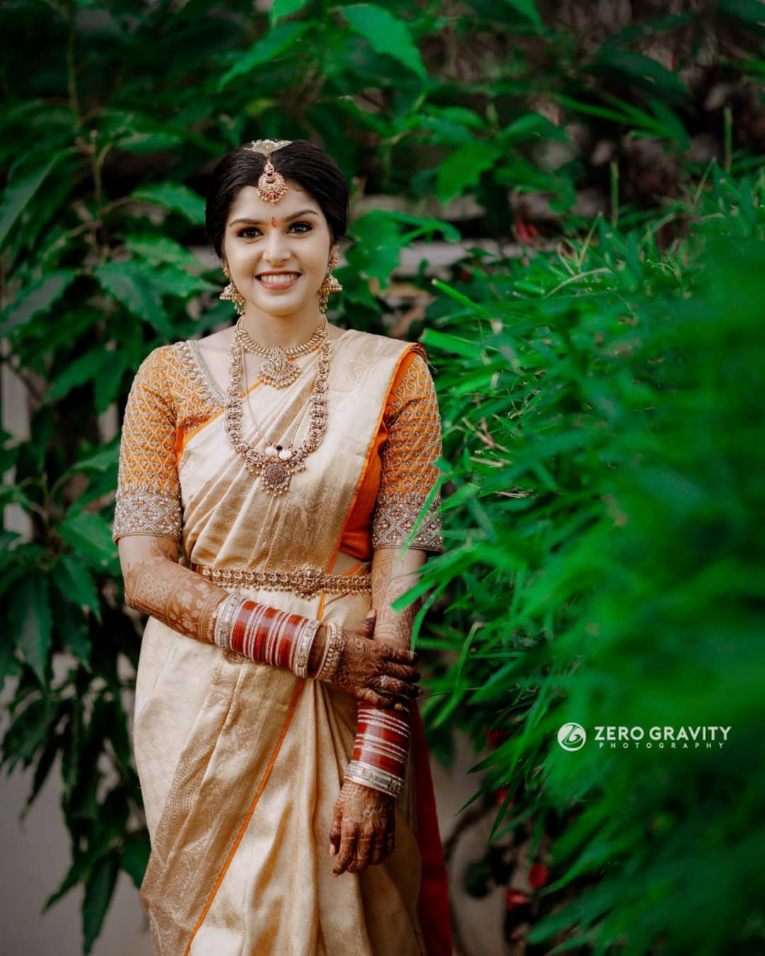 orange and golden south indian wedding saree