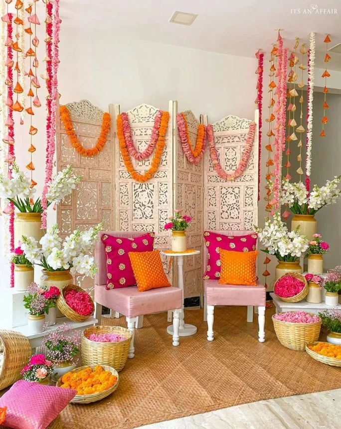 low cost simple haldi decoration at home with pink and orange flowers
