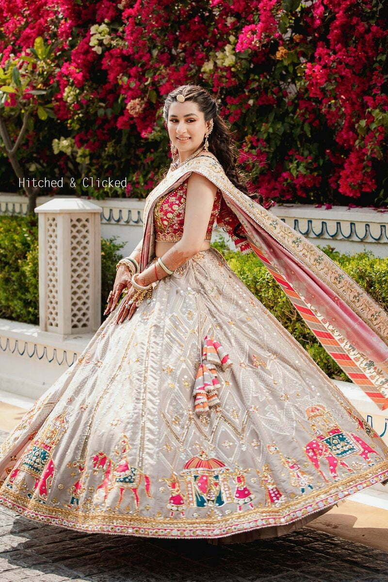 bride in simple traditional pink and grey engagement lehenga 