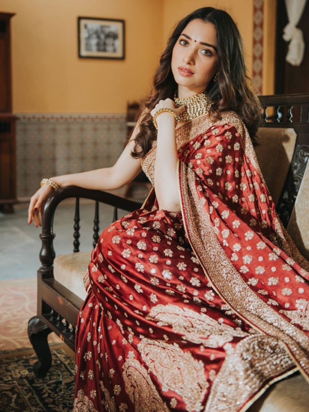 red and golden designer reception saree for bride