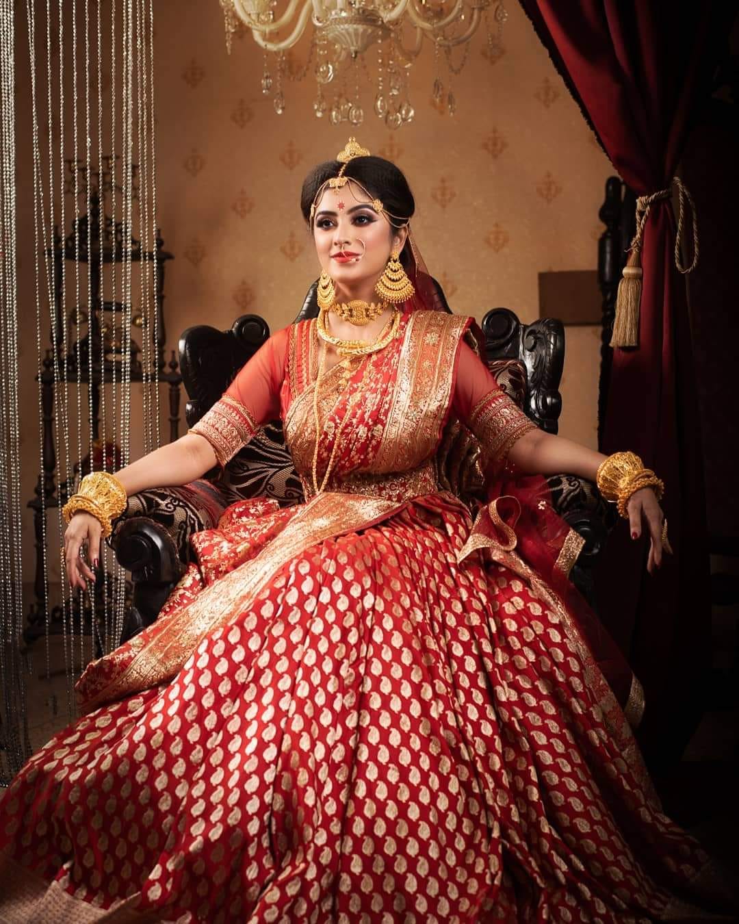 Bengali bride in red and golden banarasi silk saree 