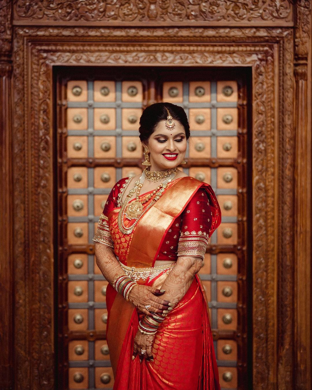 traditional south indian red kanjeevaram saree with contrast blouse