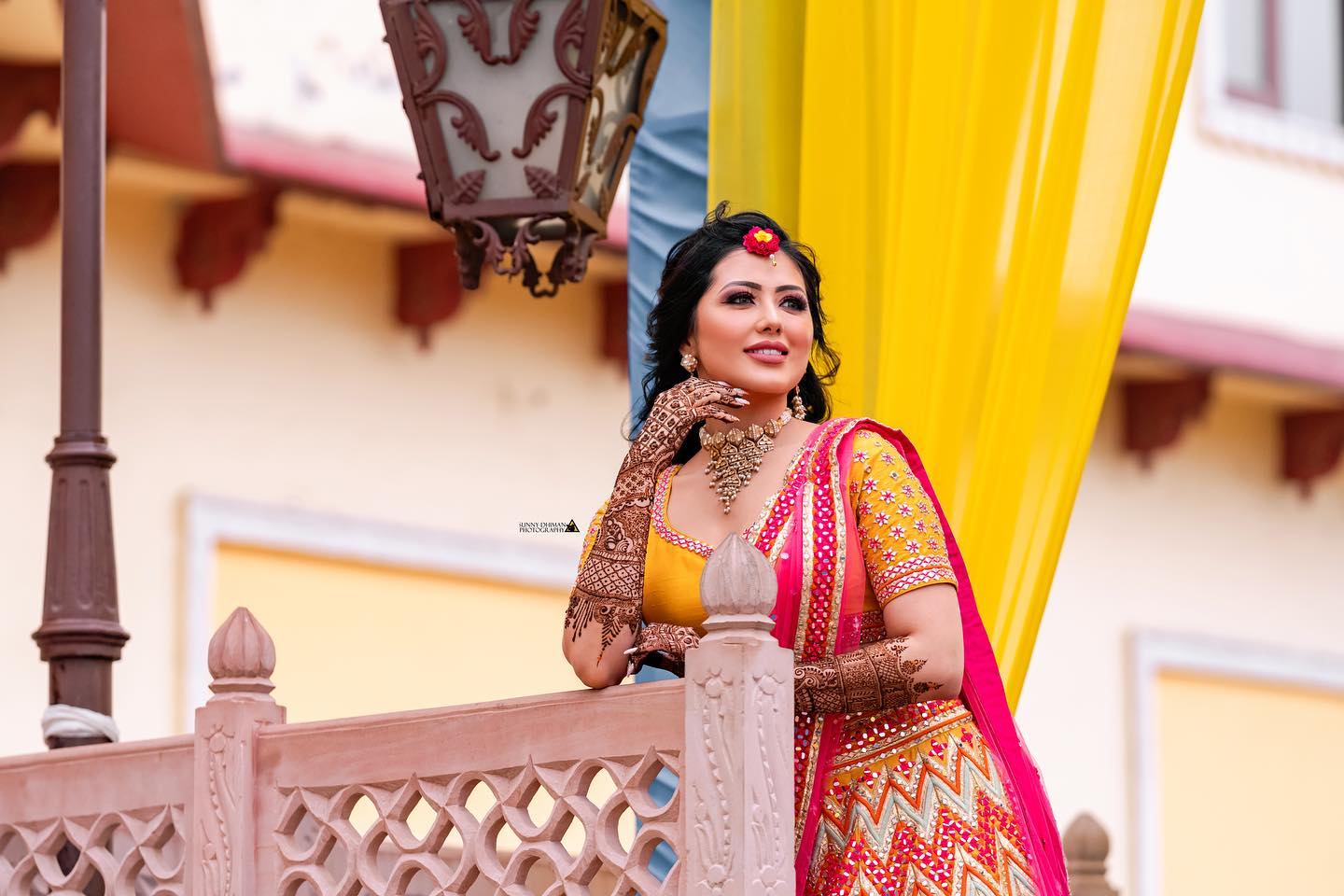 mehndi bridal photoshoot featuring standing pose