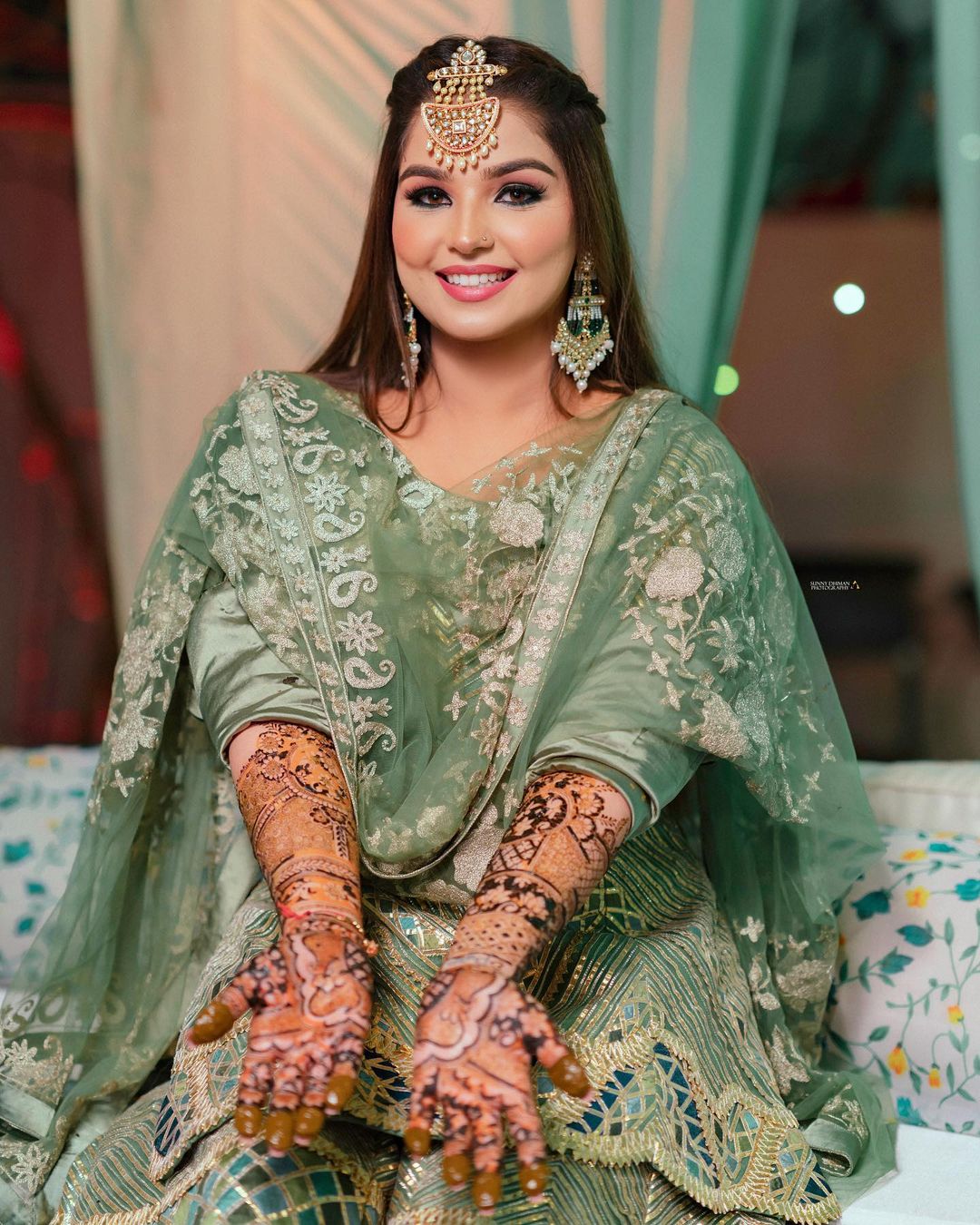 mehndi portrait with smiling bride