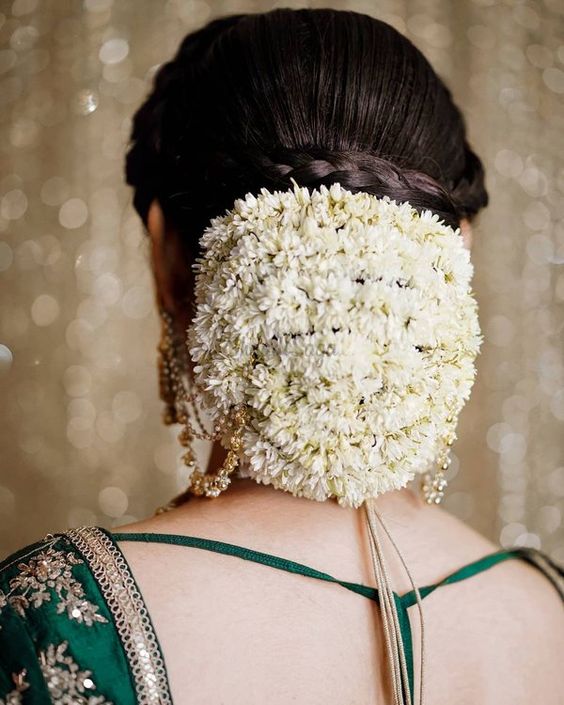 floral-bun-with-netted-gajra-braid-south-indian-bridal-hairstyle | WedAbout