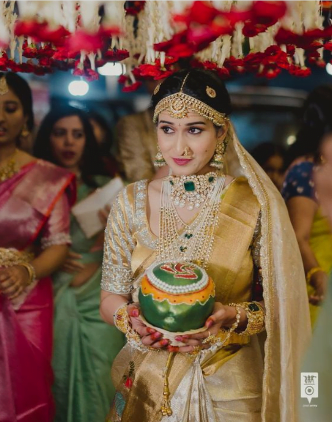 simple south indian bride in golden kanchivaram silk saree