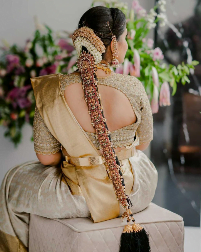 traditional poola jada south indian bridal hairstyle and golden kanjeeveram