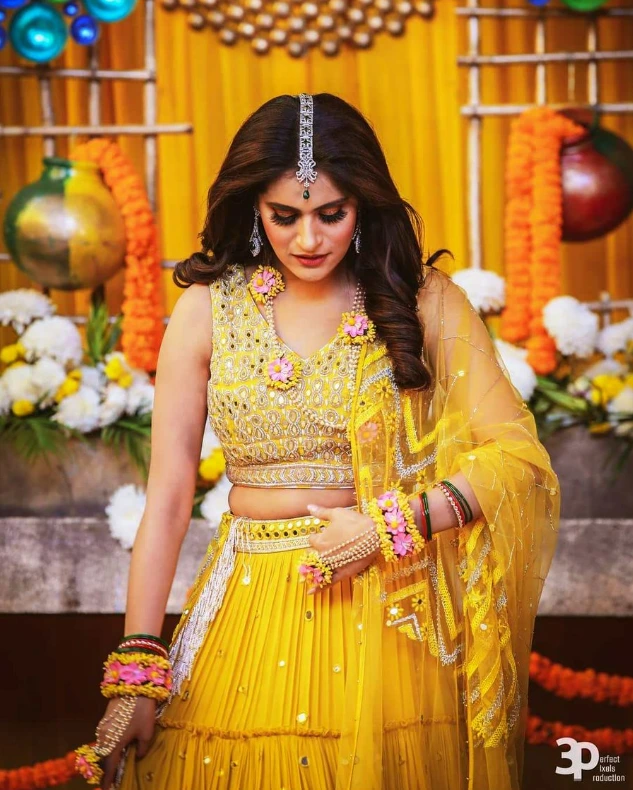 haldi look for bride featuring simple lehenga and floral jewellery